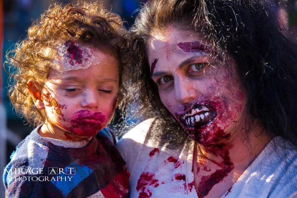 Woman and baby dressed up as zombies. Image taken by Mirage Art Photography